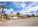 Beautiful single-story home with a well-maintained lawn and a two-car garage at 3236 Cliff Sieler Ct, Las Vegas, NV 89117