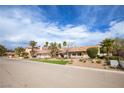 Single-story home with desert landscaping, mature trees, and a convenient two-car garage at 3236 Cliff Sieler Ct, Las Vegas, NV 89117