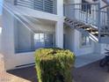 Attractive exterior of unit with stairway access; bike parked nearby at 3318 N Decatur Blvd # 1056, Las Vegas, NV 89130
