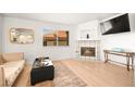 Cozy living room with a decorative fireplace, large window, and comfortable seating at 354 Sunward Dr # 0, Henderson, NV 89014