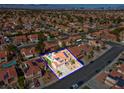 Neighborhood view of property with red tile roofs, solar panels, desert landscaping, and a blue outline for lot boundaries at 37 Stone Cress Dr, Henderson, NV 89074