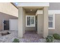 Charming front porch with brick pavers and neutral stucco siding at 4371 Fire Glow Ave, North Las Vegas, NV 89084