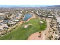 Wide aerial view of the golf course community, highlighting the lush green fairways and surrounding homes at 4963 Pensier St, Las Vegas, NV 89135