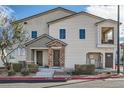 Charming townhome exterior with stone accents, private balcony, and well-maintained landscaping at 524 Teovani St # 826, Henderson, NV 89052