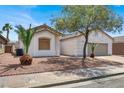 Inviting single-story home with well-maintained desert landscaping and a quaint front yard at 531 Coolidge Ave, Henderson, NV 89015