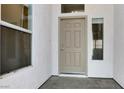 Welcoming front door with sidelight windows, providing natural light to the entryway at 531 Coolidge Ave, Henderson, NV 89015