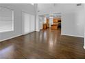 Spacious, bright living room with hardwood floors and open access to the kitchen at 5638 Breckenridge St, North Las Vegas, NV 89081