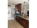 Well-equipped kitchen with stainless steel appliances, granite countertops, and stylish lighting at 6225 Factor Ave, Las Vegas, NV 89107