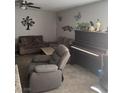 Inviting living room featuring a comfortable sectional sofa and an upright piano at 6225 Factor Ave, Las Vegas, NV 89107
