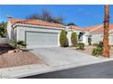 Lovely single-story home with a well-maintained front yard and a spacious two-car garage at 7772 Buckwood Ct, Las Vegas, NV 89149