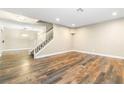 Spacious living room with wood floors and neutral paint offers a blank canvas for new owners at 8224 Crystal Star Ct, Las Vegas, NV 89145