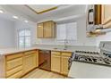 Modern kitchen with stainless steel appliances, updated countertops, and plenty of cabinet space at 8408 Running Deer Ave # 103, Las Vegas, NV 89145