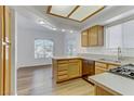 Bright kitchen featuring stainless steel appliances, light wood cabinets, and island at 8408 Running Deer Ave # 103, Las Vegas, NV 89145