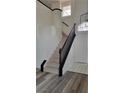 Bright entryway showcasing the staircase with dark wood trim and decorative lighting at 9008 Cotton Rose Way, Las Vegas, NV 89134