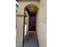 A view of the home's front door with a welcome mat at 961 Spiracle Ave, Henderson, NV 89002