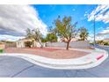 Exterior view of a single-story home showcasing desert landscaping at 1516 Dusty Canyon St, Henderson, NV 89052