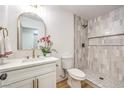 Stylish bathroom featuring a sleek vanity and a modern tiled shower at 1731 Sherwin Ln, Las Vegas, NV 89156