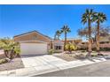 Beautiful one-story home featuring desert landscaping, palm trees, and a convenient two-car garage at 1821 Eagle Mesa Ave, Henderson, NV 89012