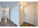 Bright entryway featuring hard surface floors and white trim throughout at 2110 Sealion Dr # 101, Las Vegas, NV 89128