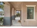 Covered entryway with neutral toned walls and decorative archways at 2231 Desert Prairie St, Las Vegas, NV 89135