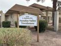 A Paradise Valley Townhomes sign at 5050 S. Eastern Ave at 2425 Paradise Village Way, Las Vegas, NV 89120