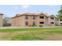 Exterior shot of a two story condo building with desert landscaping and green lawns at 2451 N Rainbow Blvd # 2067, Las Vegas, NV 89108