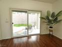Bright living room with sliding glass doors to outdoor patio area with new furniture at 2575 Evening Twilight Ave, Henderson, NV 89044