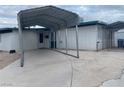 Exterior view of a home with a large carport and concrete driveway at 3100 Sequoia Ave, Las Vegas, NV 89101