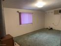 Living room interior view with carpet flooring and natural light at 3100 Sequoia Ave, Las Vegas, NV 89101