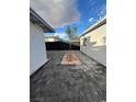 Paved backyard features fresh landscaping, small trees, and privacy fence at 321 Beaumont St, Las Vegas, NV 89106