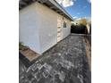 Side yard with modern pavers and fresh landscaping at 321 Beaumont St, Las Vegas, NV 89106