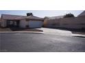 Single-story home featuring a tiled roof, two-car garage, and concrete driveway at 3745 Saint Peter Ct, North Las Vegas, NV 89031