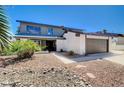 View of home with mature landscaping and a walkway leading to the covered front porch at 3953 E Reno Ave, Las Vegas, NV 89120