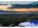 Beautiful pool with a view of the city skyline at sunset at 515 Serenity Point Dr, Henderson, NV 89012