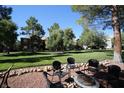Relax outdoors at the common area with a fire pit and comfortable seating, set amongst the lush landscaping at 555 E Silverado Ranch Blvd # 1171, Las Vegas, NV 89183