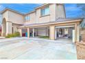 Attached three-car garage has ample space, storage, and open doors at 694 Tomscott Ave, Henderson, NV 89052