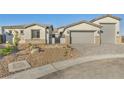 Charming home featuring a three-car garage and xeriscaping for low maintenance at 9570 Verde Way, Las Vegas, NV 89149