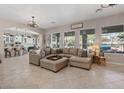 Spacious living room with plush seating and views to the outdoor pool at 9668 Doraville Ave, Las Vegas, NV 89149