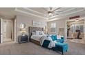 Main bedroom with stylish tray ceiling and bonus workout room at 9668 Doraville Ave, Las Vegas, NV 89149