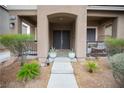 Inviting front porch with desert landscaping and covered entrance at 10323 Hardy Falls St, Las Vegas, NV 89141