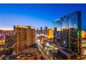 Stunning city view showcasing modern high-rise buildings and bustling streets at dusk at 125 E Harmon Ave # 2801&2803, Las Vegas, NV 89109