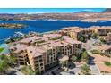 Beautiful lakefront condos with tile roofs, palm trees, lush landscaping and waterway access at 15 Via Mantova # 308, Henderson, NV 89011