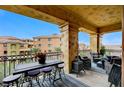 Spacious outdoor balcony with comfortable seating, offering scenic community views at 15 Via Mantova # 308, Henderson, NV 89011