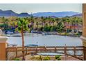 View of the lake from condo balcony with dock and boats and other homes in the community at 15 Via Mantova # 308, Henderson, NV 89011