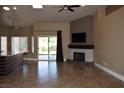 Cozy living room featuring a modern fireplace with a mounted television at 2744 Pala Dura Dr, Henderson, NV 89074