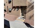 Close up of the exterior of the building with stucco and unit number 104 at 2967 Juniper Hills Blvd # 104, Las Vegas, NV 89142