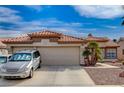 Charming single story home with 2-car garage, desert landscaping, and a tile roof at 3509 Altar Rock Ln, North Las Vegas, NV 89032
