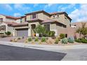 Beautiful two-story house showcasing desert landscaping, brick accents, and a mountain backdrop at 3512 Portiani Dr, Las Vegas, NV 89141