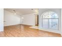 Bright living area boasting wood flooring, arched windows, and open layout, perfect for modern living at 3673 Ian Thomas St # 201, Las Vegas, NV 89129