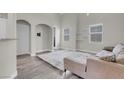 Bright living room with vaulted ceiling and neutral tones at 3975 N Hualapai Way # 235, Las Vegas, NV 89129